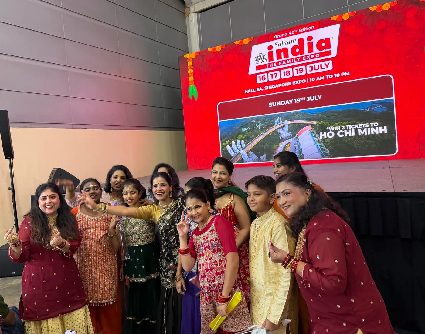 The ensemble celebrating on stage